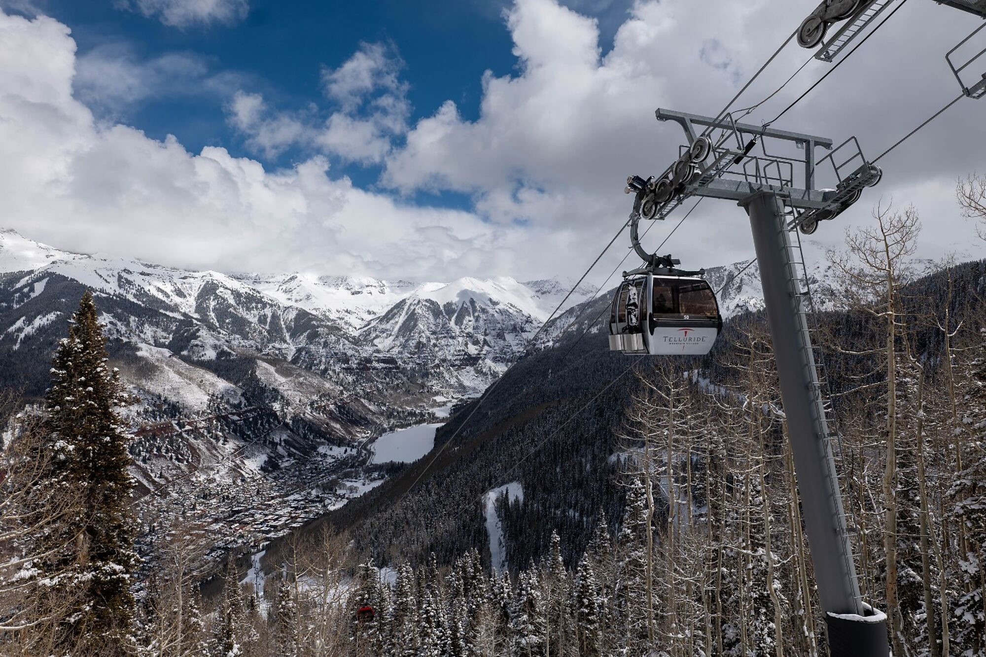 Free gondola descending toward historic downtown Telluride, Colorado